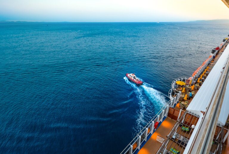 Small boat going away from the cruise