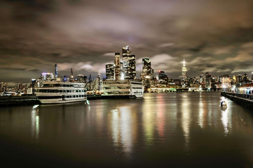 Boats in Port of New York City, USA at Night