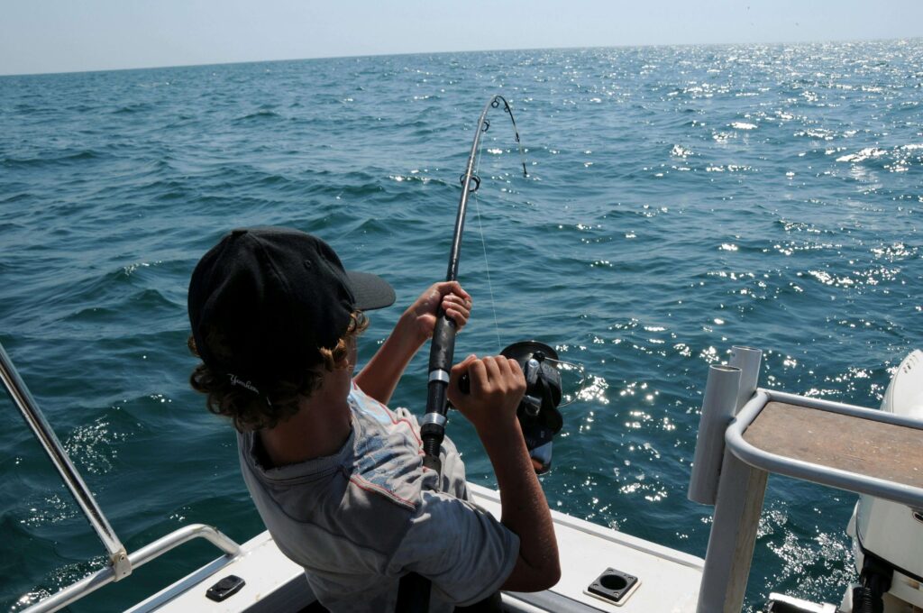 Guy reeling in a fish